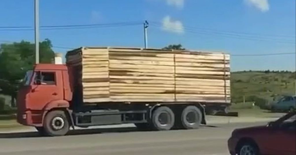 The fuel tanker’s tarp disguises it as a truck hauling boards The fuel tanker’s tarp disguises it as a truck hauling boards